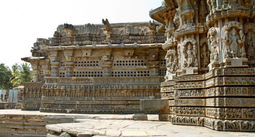 Grilled windows are carved intricately in stone